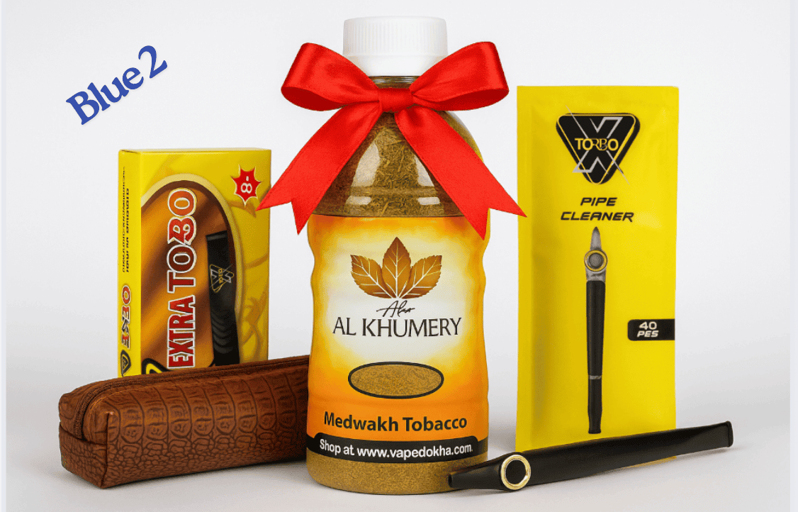 Al Khumery Dokha tobacco bottle with a red bow, Extra Toro packaging, and vape device on a white background. blue 2 vape dokha
