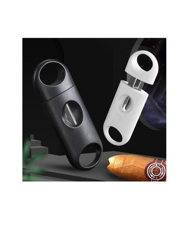 Black and white cigar cutters with a cigar on a dark background. Vape Dokha