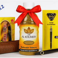 Collection of dokha tobacco products including a bottle, packaging, and accessories on a white background. Bla.ck 2 vape dokha